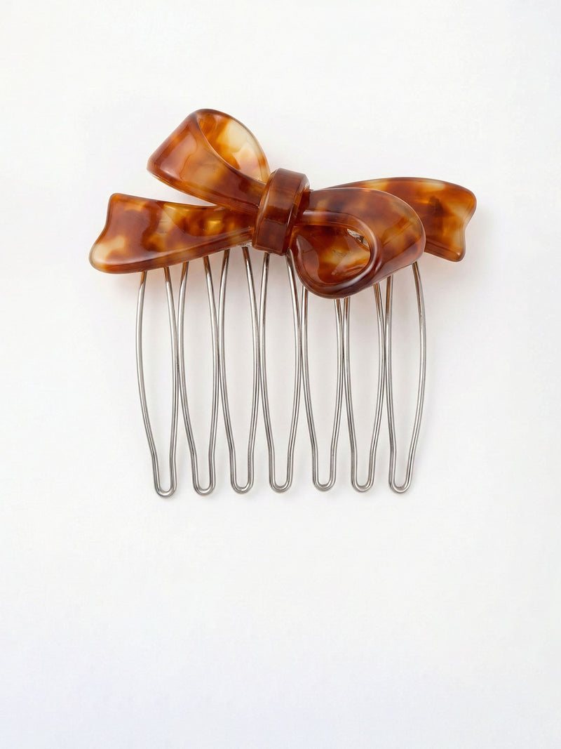 Vintage Bow Amber Haarkamm Produktfoto – herbstlicher Schleifenkamm in Bernsteinton auf weissem Hintergrund