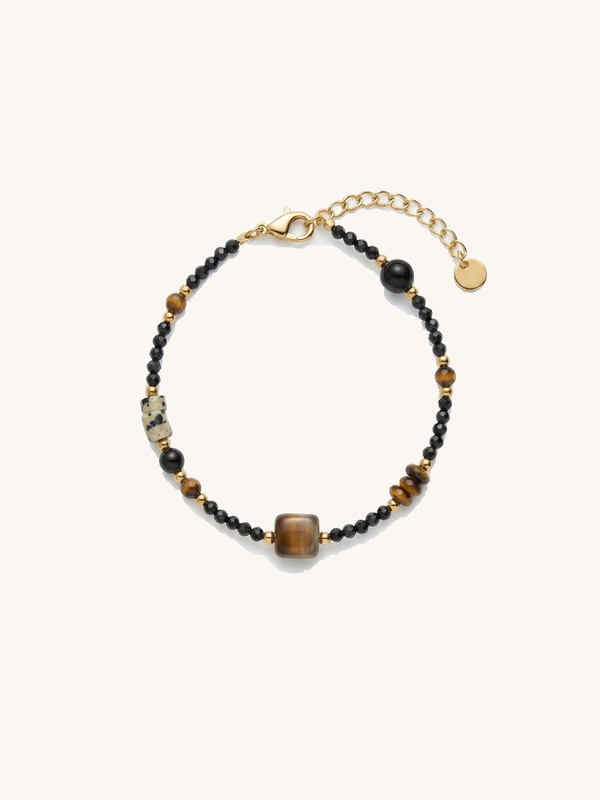 Armband Eclipse – Handgefertigtes Armband mit Tigerauge, schwarzem Obsidian und tibetischer Dzi-Perle, weisser Hintergrund