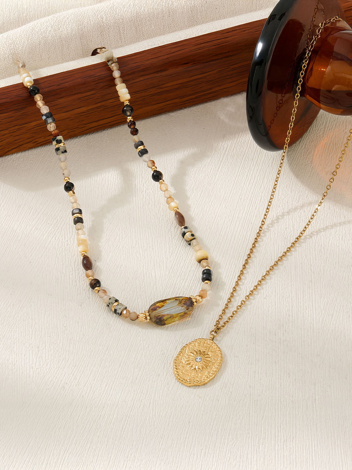 Kette Amberlicht – mit goldenem Talisman