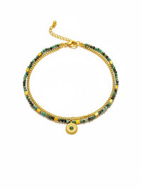 Afrikanischer Turkis Armband komplett auf weissem Hintergrund - Doppelreihiges Boho Design mit goldenem Sonnenblumen Charm