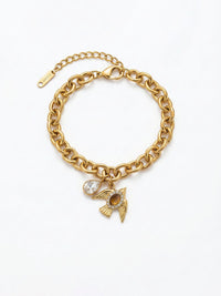 Armband Liberte Produktbild – Seitenansicht der goldenen Gliederkette mit Vogelcharm