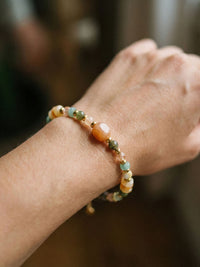 Armband Sonnenreise Armband am Handgelenk getragen – Edelstahl, Orange/Gruen/Gold