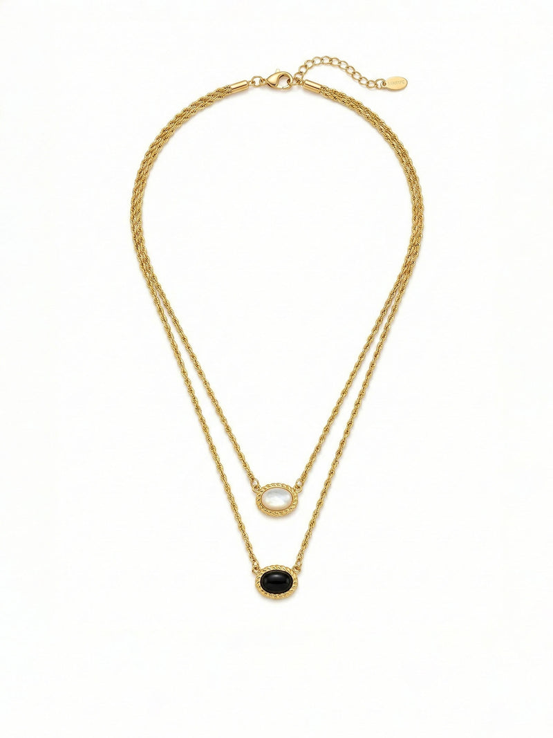 Yin Yang Glow Kette Detail – Nahansicht der Katzenauge-Steine und goldenen Seilketten