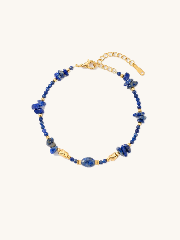 Deep Sea Bracelet – Handcrafted lapis lazuli bracelet with golden accents, royal blue with pyrite inclusions, white background