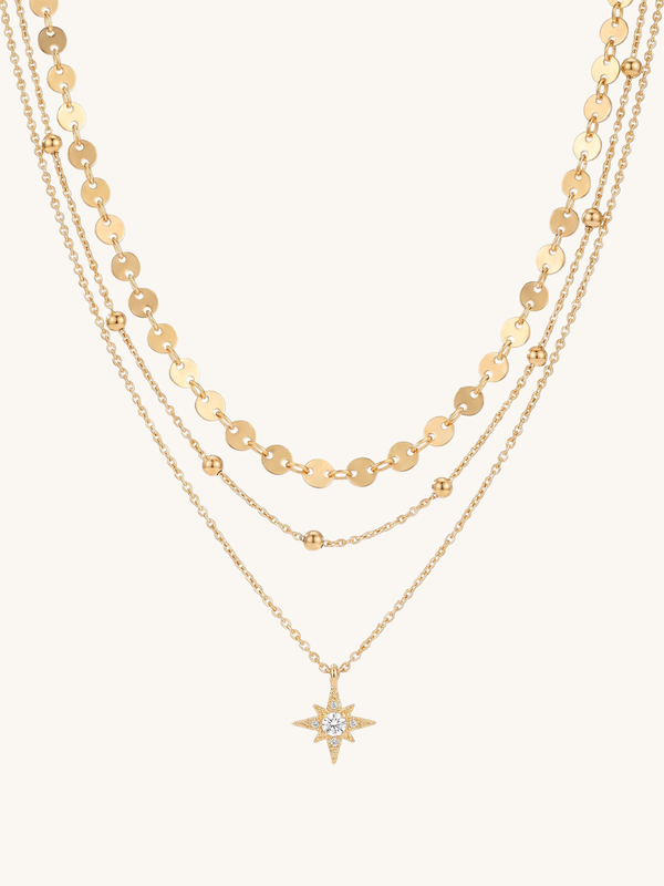 Kette Northern Star – Münz-Layering Kette mit Nordstern und Zirkonia, 18K vergoldet – weißer Hintergrund