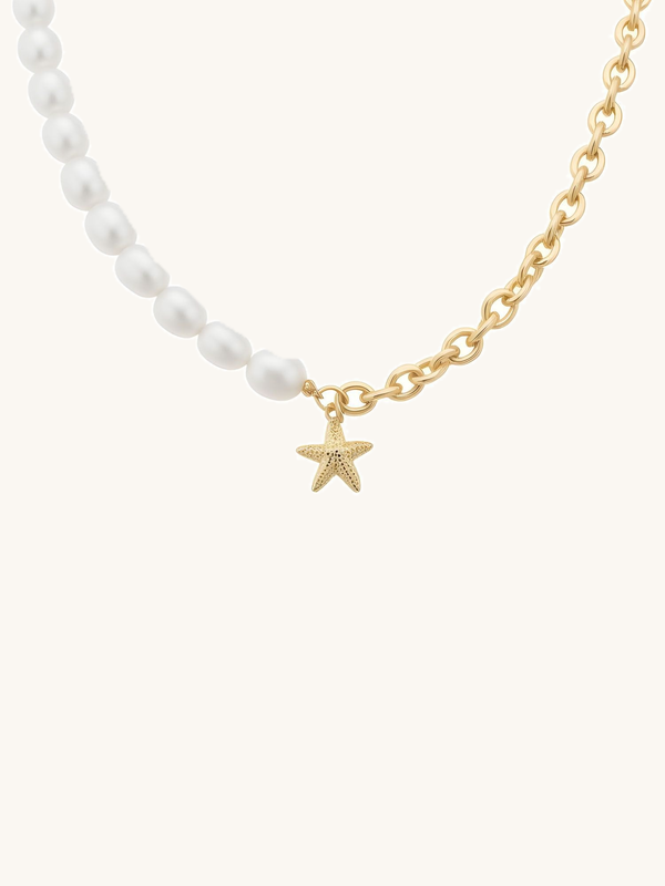 Ocean Kiss pearl necklace product photo – freshwater pearl necklace with a golden starfish pendant on a white background